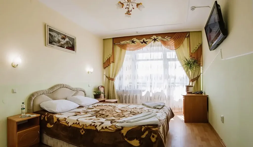 Спальня номера 2-кімнатний Люкс у санаторії «Арніка» в Трускавці